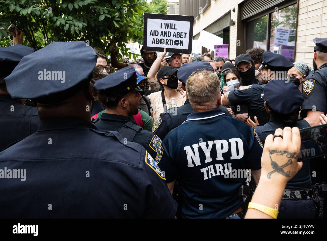 Prochoice protestors try to push back NYPD officers and prolife