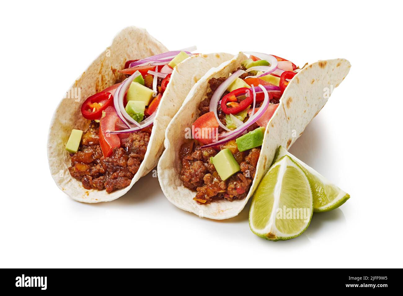 Two tacos with ground beef and lime on white background Stock Photo