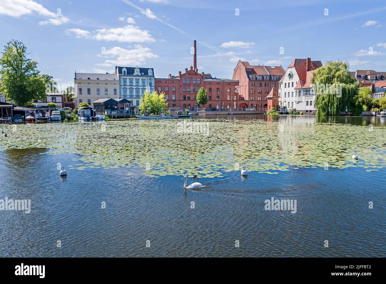 Brandenburg an der Havel, Germany - June 14, 2022: Street Muehlendamm with the building of the old mill. View from Neustaedtisches Wassertor over the Stock Photo