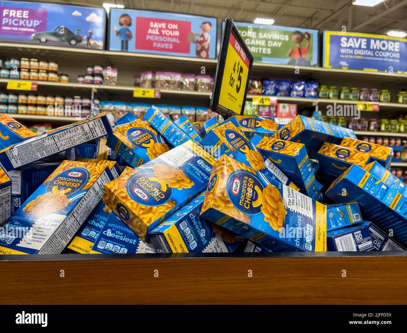 Everett, WA USA - circa June 2022: A large bin filled with Kraft macaroni and cheese boxes inside a Fred Meyer grocery store. Stock Photo