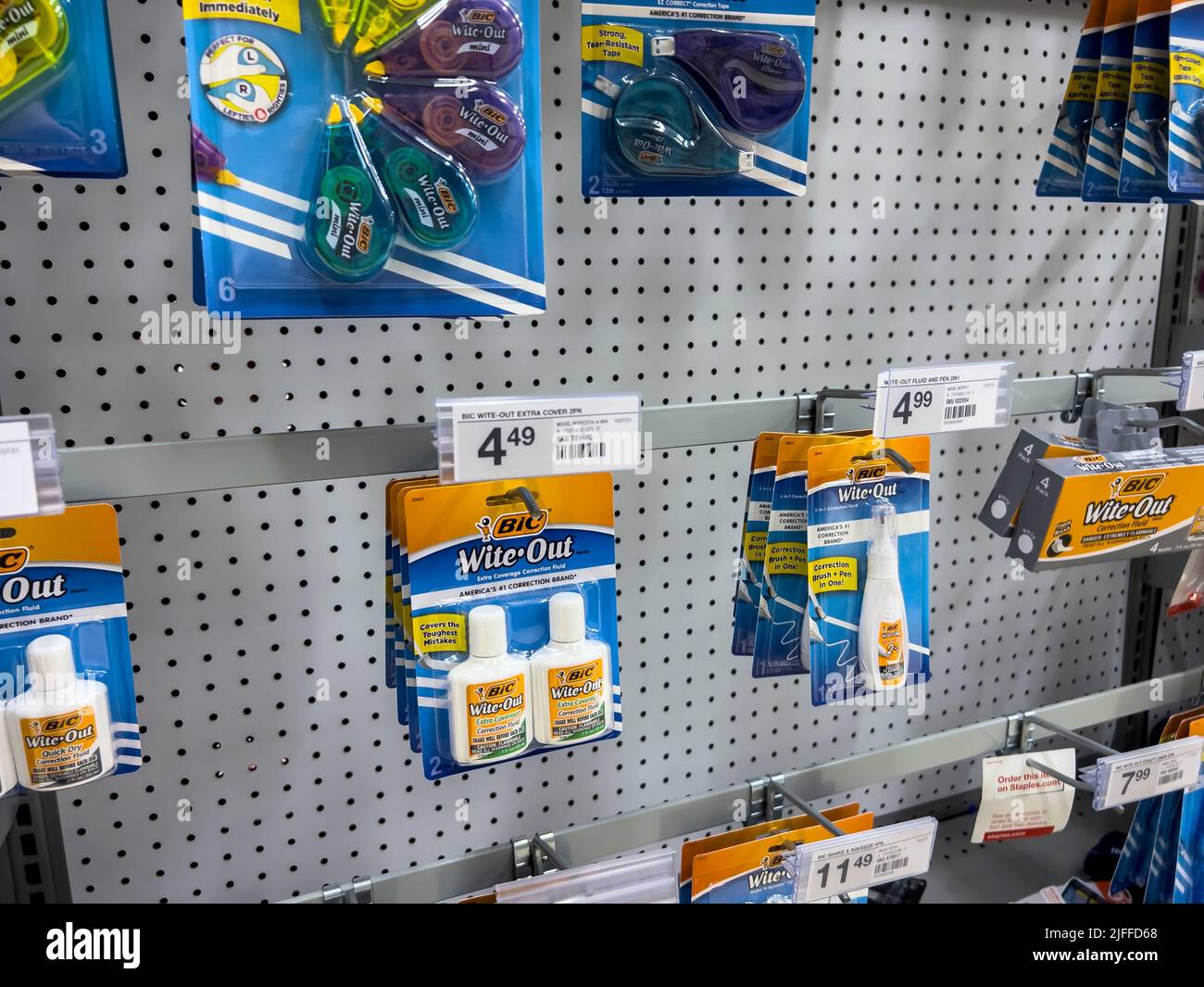 Mill Creek, WA USA - circa June 2022: Angled view of White Out products for sale inside a Staples store. Stock Photo