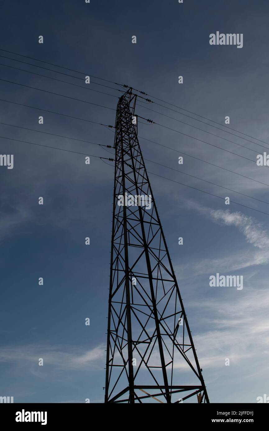 A vertical low angle shot of a transmission tower Stock Photo - Alamy