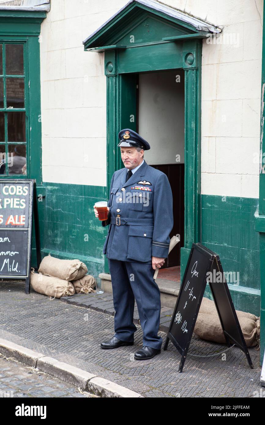 soldier having a English pint of beer, full uniform RAF, re enactment Stock Photo
