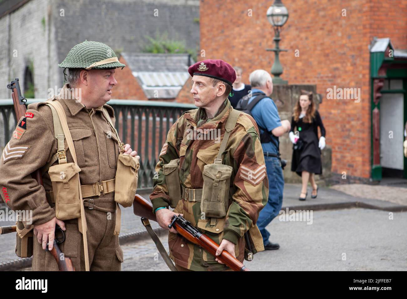 two males Sergent's soldiers in full battle uniform talking, ww2 concept Stock Photo