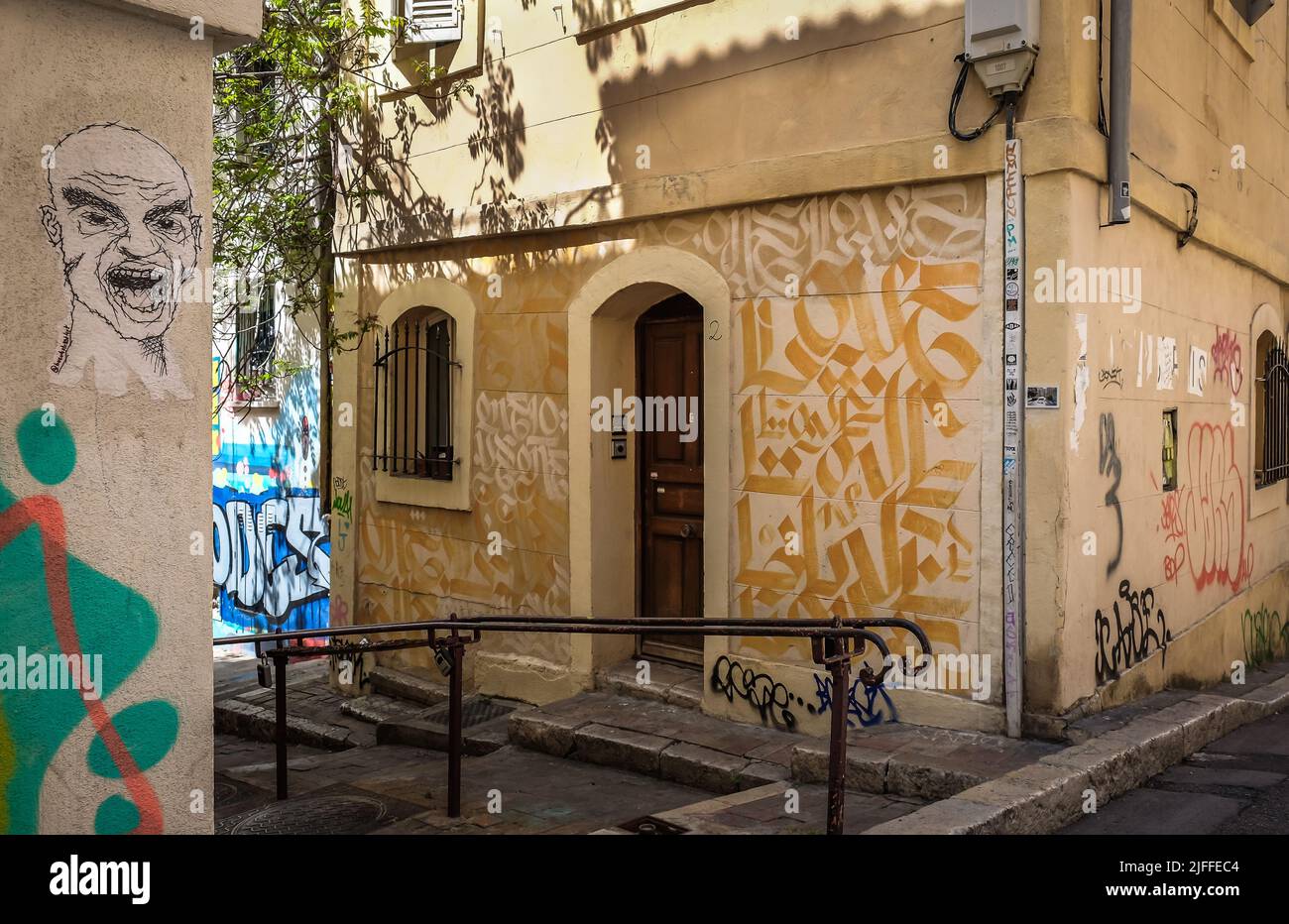 Marseille, France, May 2022, view of a narrow street with mural in Le Panier district Stock Photo