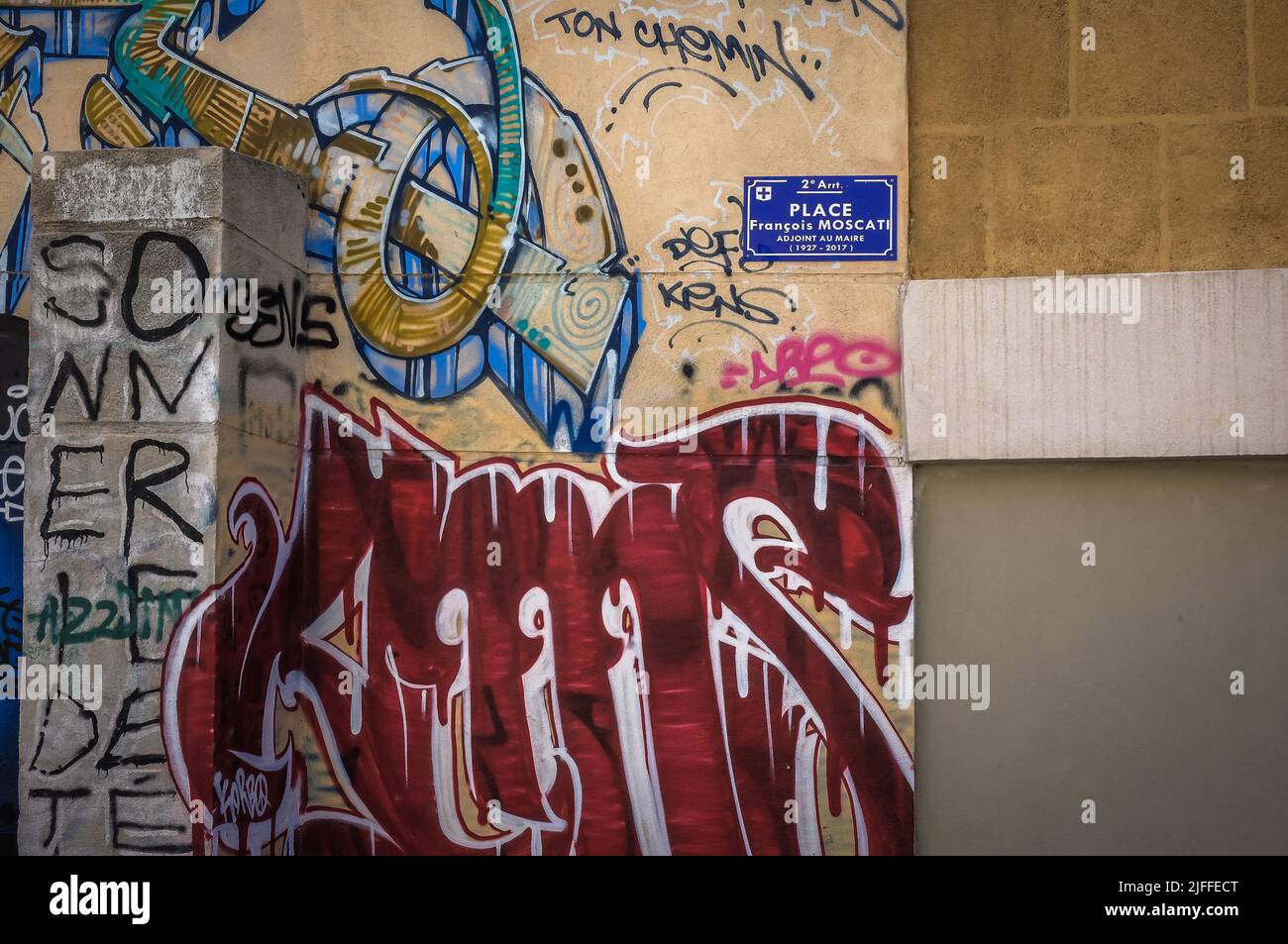 Marseille, France, May 2022, close up of a wall with a street sign and a mural in Le Panier district Stock Photo