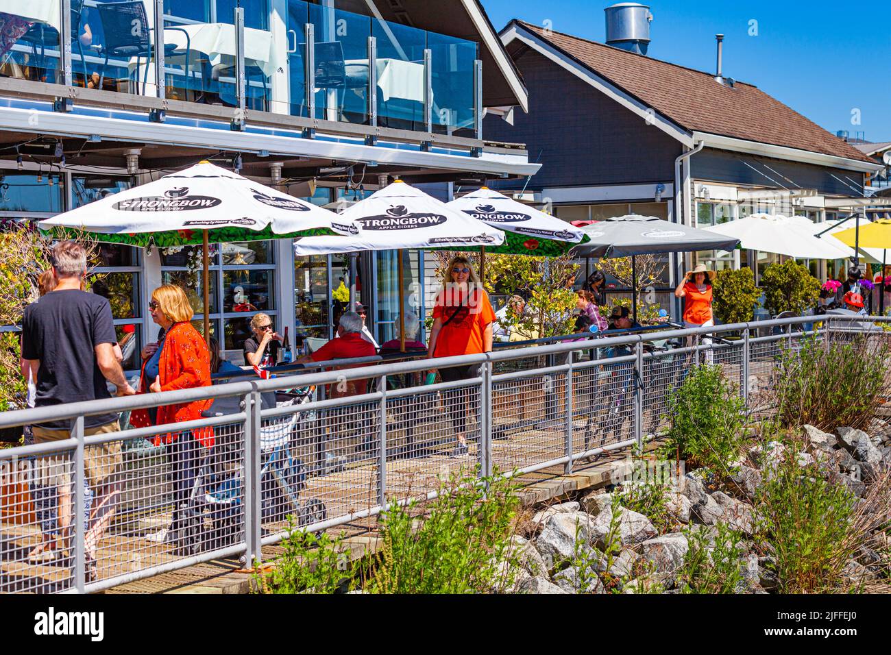 People walking and dining along the Steveston waterfront on Canada Day 2022 Stock Photo
