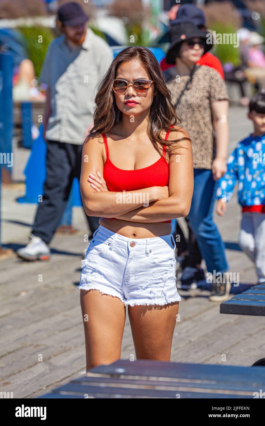 Young woman dressed in red and white for Canada Day festivities in Steveston British Columbia Stock Photo