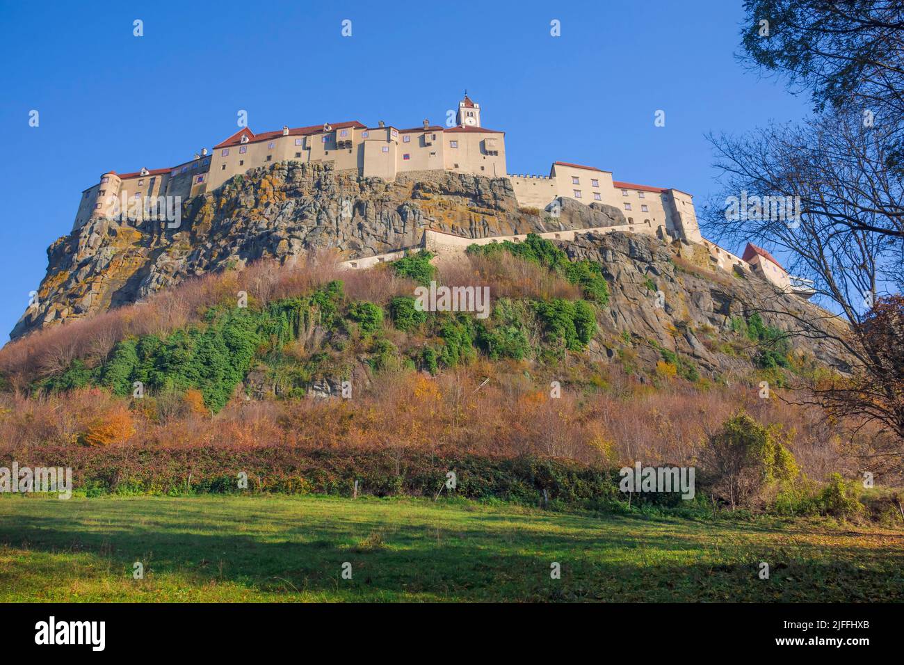 The medieval Riegersburg Castle on top of a dormant volcano, surrounded by beautiful autumn landscape, famous tourist attraction in Styria region, Aus Stock Photo