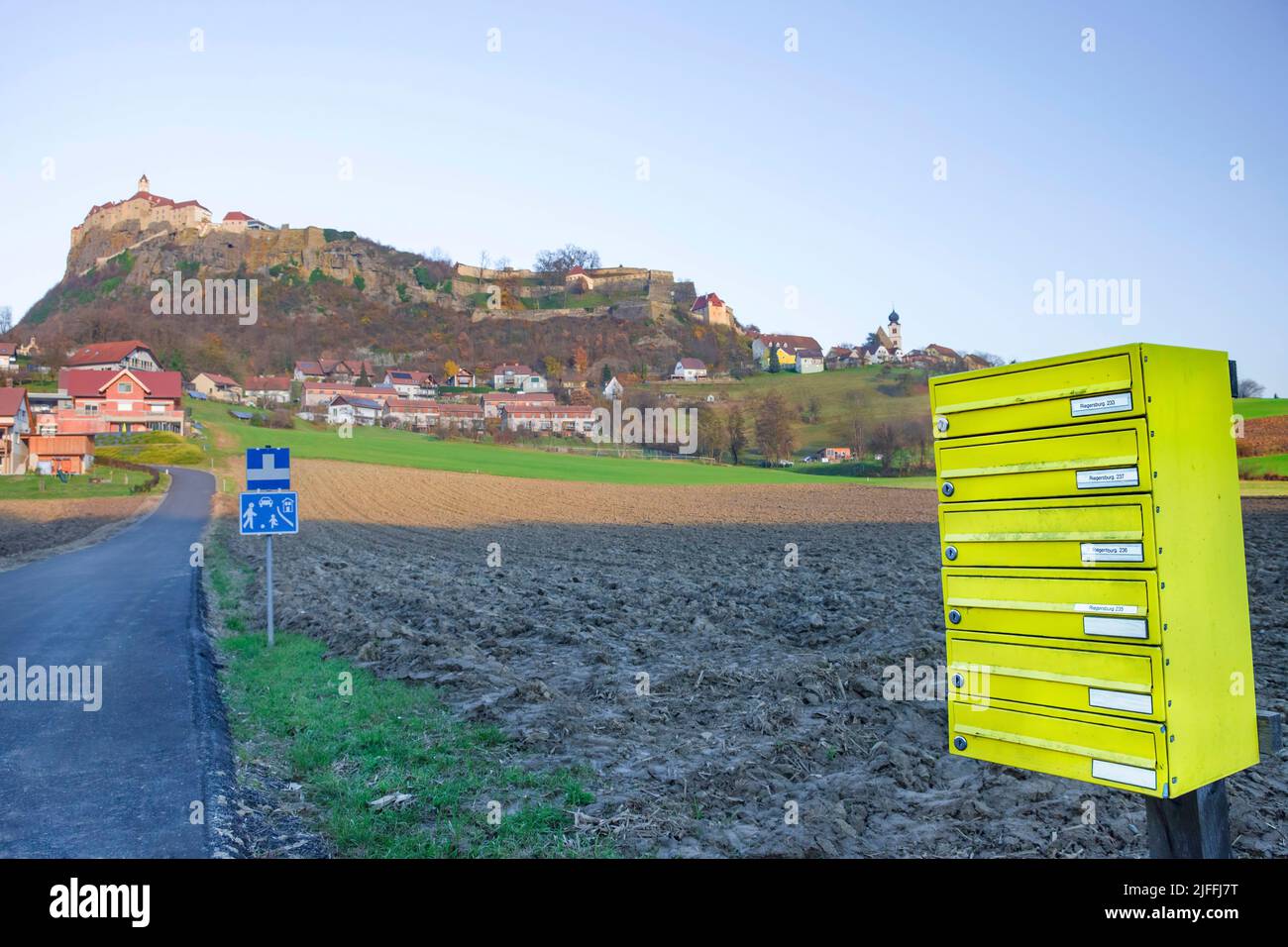 Big yellow mailbox near the medieval Riegersburg Castle on top of a ...