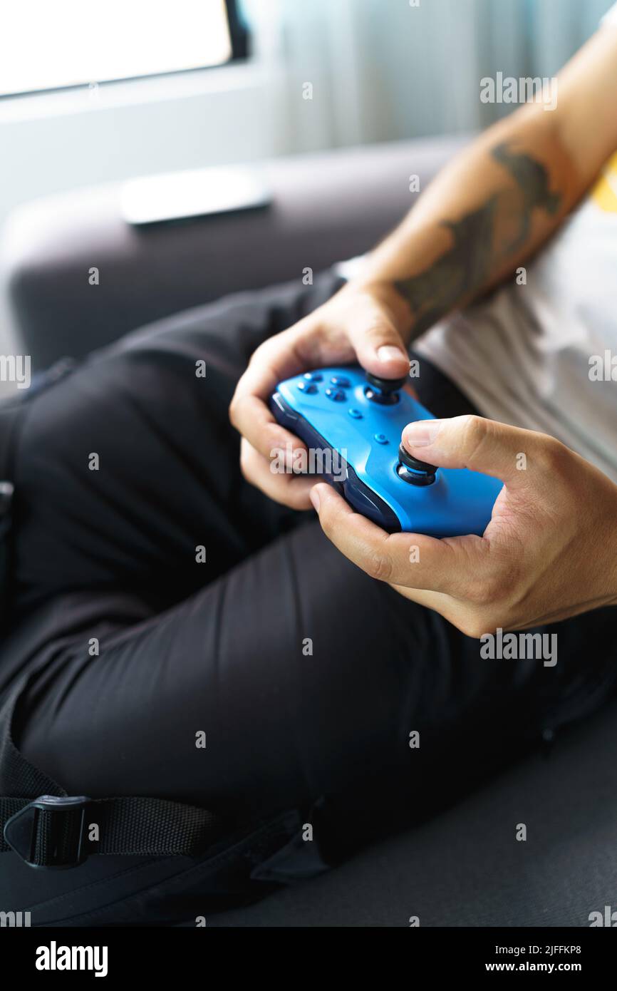 Approach to hands playing with remote video game control, modern hobbies, electronic devices