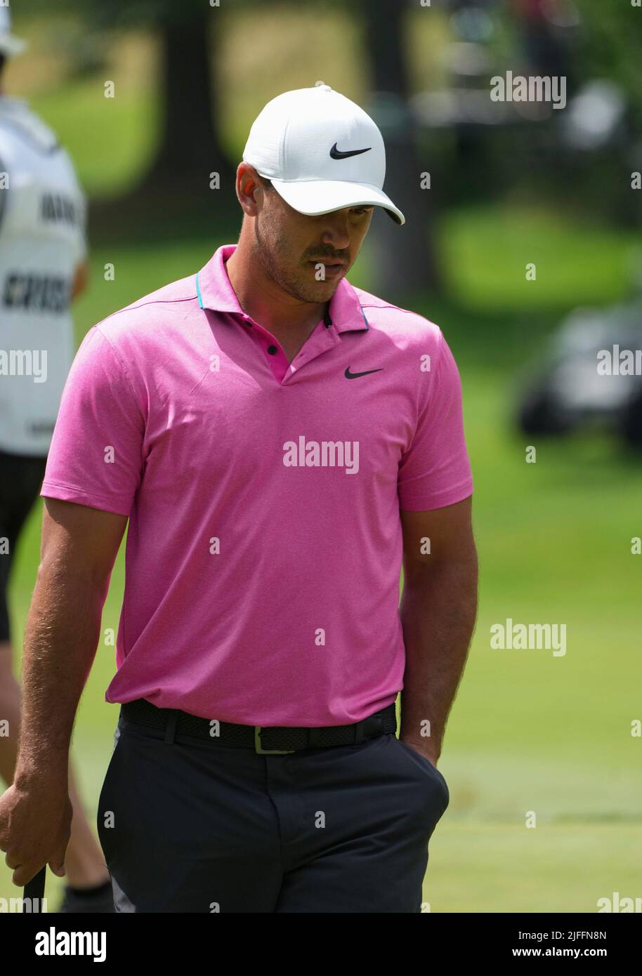 Brooks Koepka watches his ball 