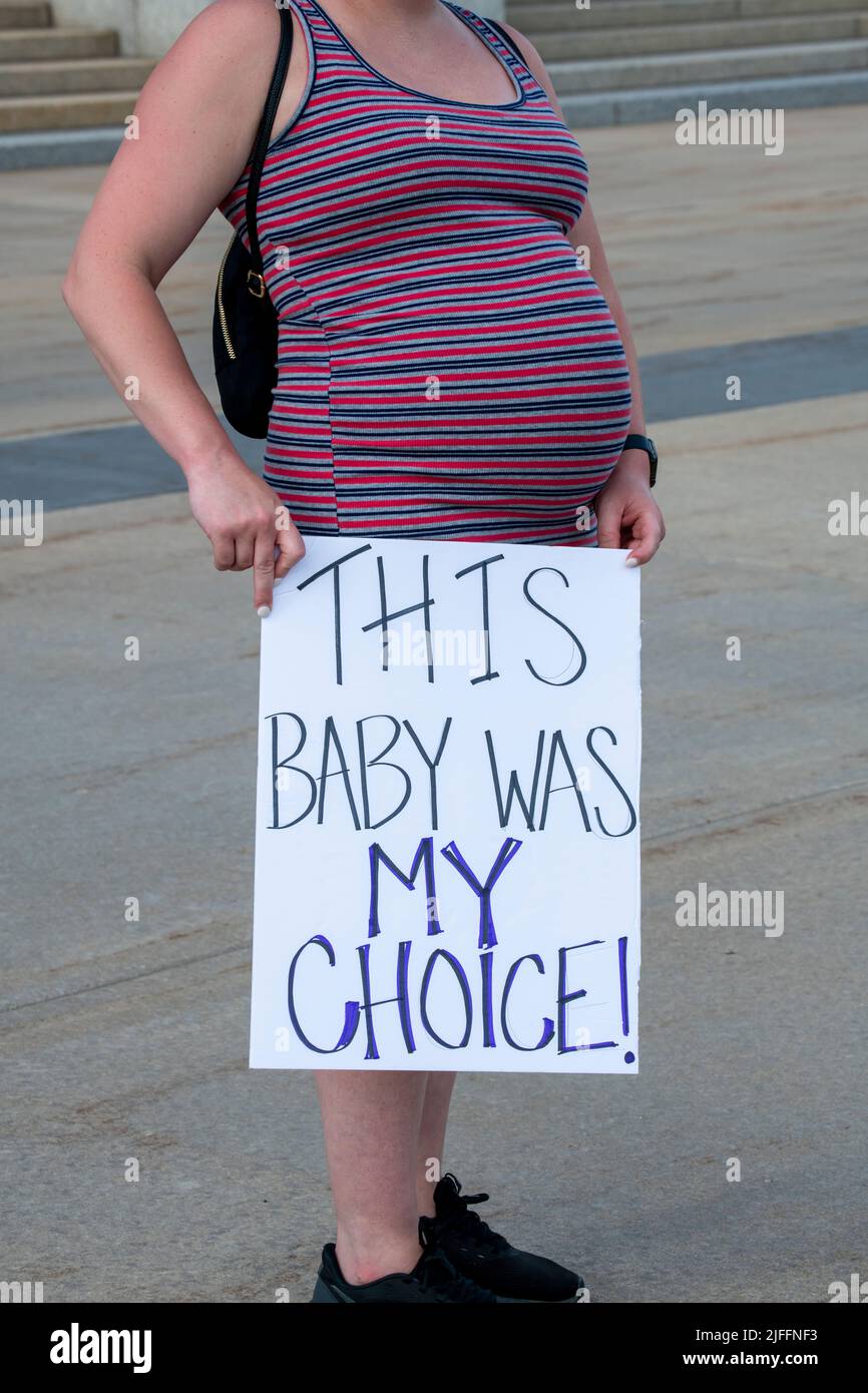 St. Paul, Minnesota. June 25, 2022. Supporters of abortion rights rally at the capitol following the scrotus ruling Roe V Wade.  Pregnant woman holdin Stock Photo