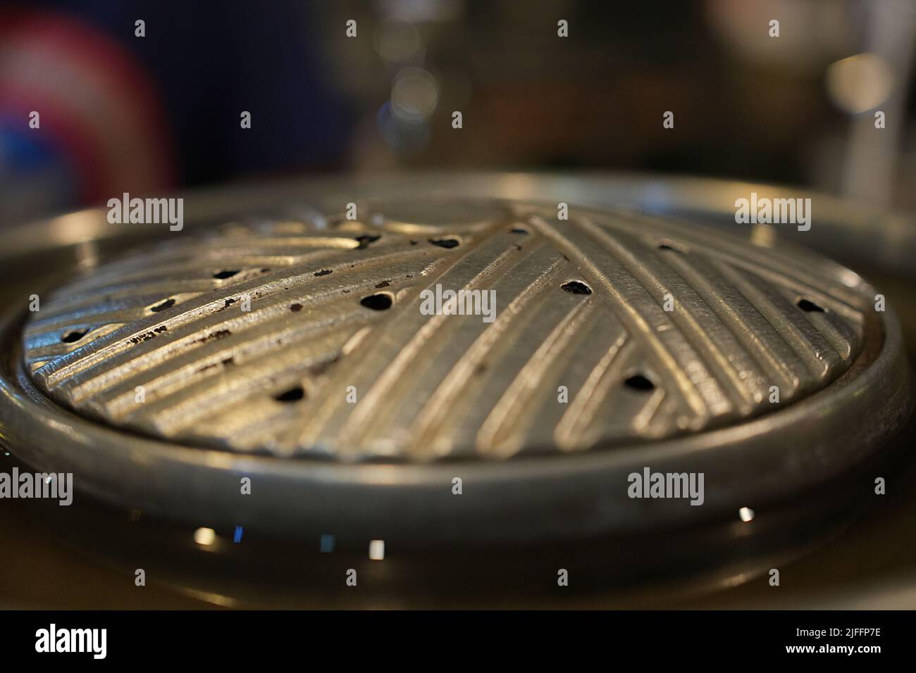 The Close up side view of grill pan. Grill barbecue on pan street