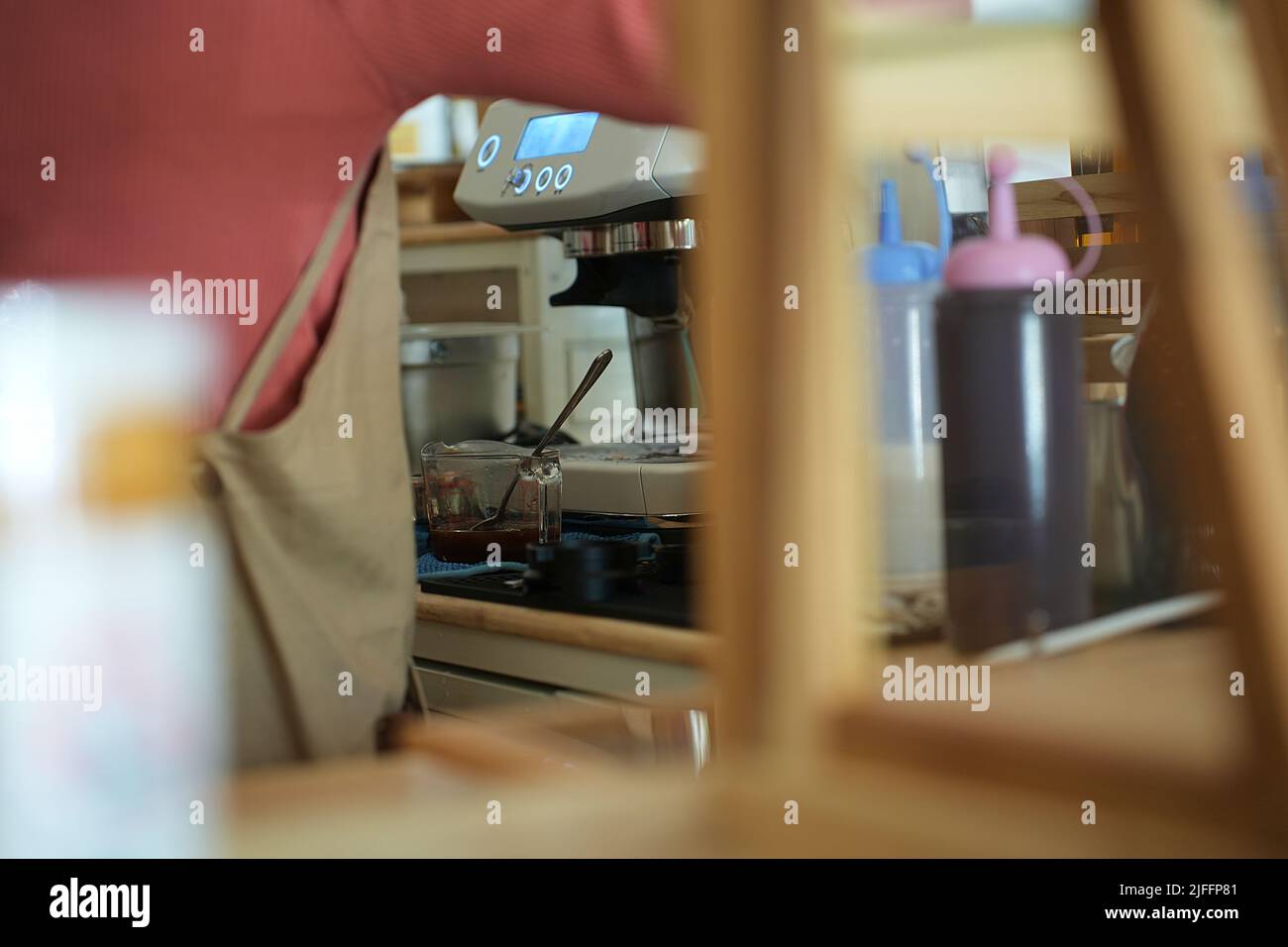 Behind the scenes, coffee shop barista making lattes Stock Photo Alamy