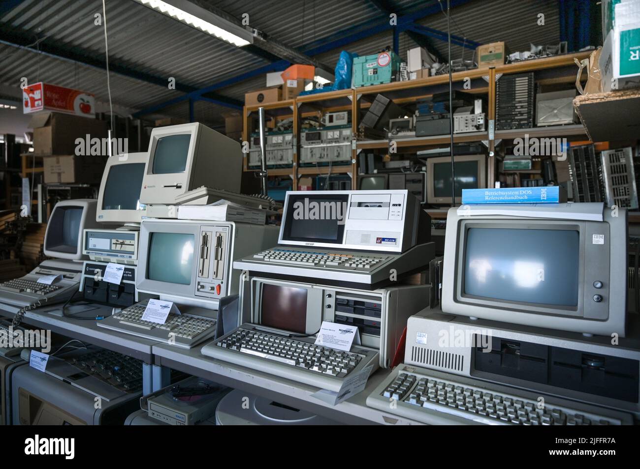 28 June 2022, Saxony-Anhalt, Halle (Saale): Personal computers from the 80's from Commodore, Sharp and IBM. The Rechenwerk - Computermuseum Halle shows devices of computing and automation technology mainly from East Germany. (to dpa 'Unique memories of the beginning of the computer age') Photo: Heiko Rebsch/dpa Stock Photo