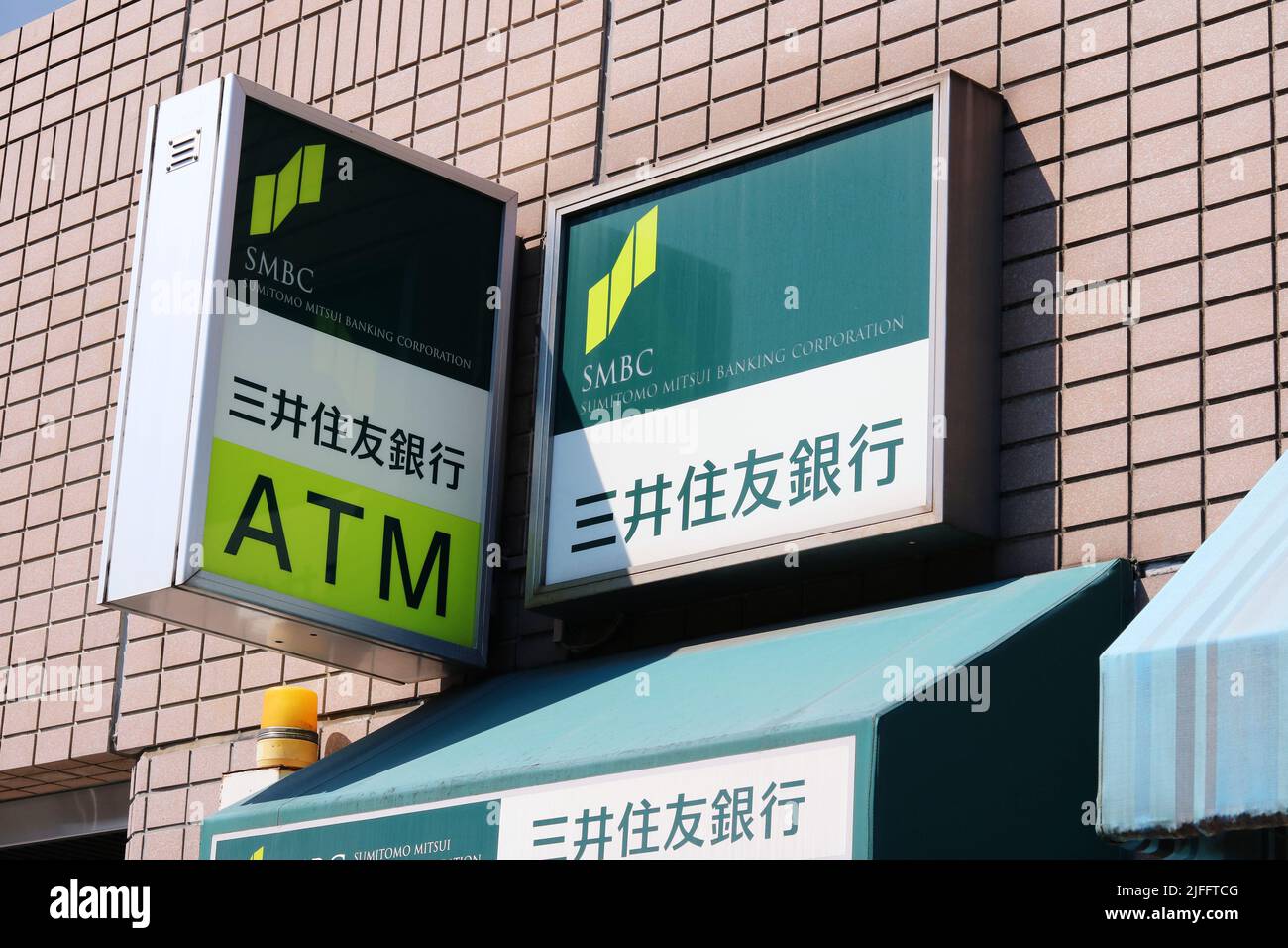 TOKYO, JAPAN - June 30, 2022: Sign on an SMBC bank ATM facility in Tokyo's Tsukiji area. Stock Photo