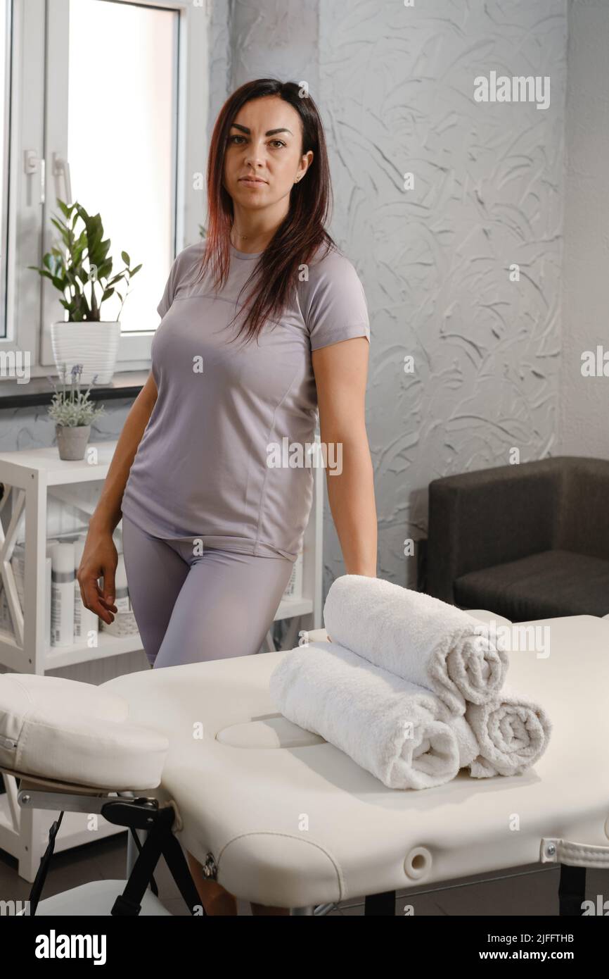 Female massage specialist, physiotherapy expert or massage specialist
