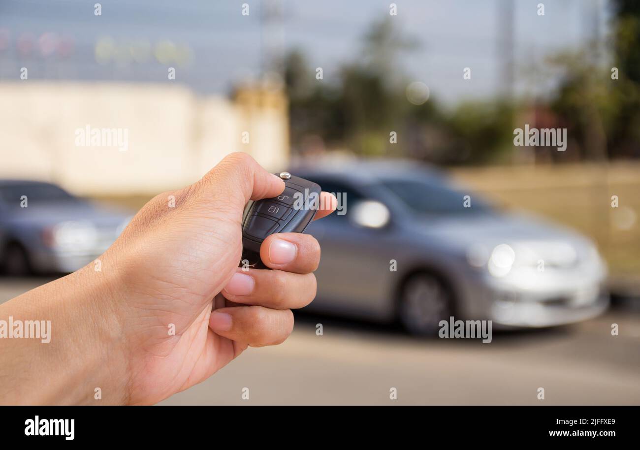 Close up Hand holding car key Stock Photo - Alamy