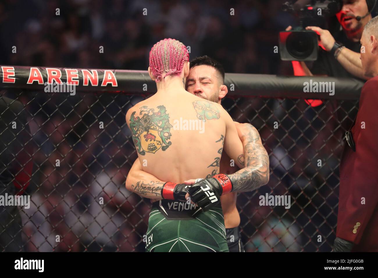 Las Vegas, United States. 02nd July, 2022. LAS VEGAS, NV - JULY 2: (R-L) Pedro Munhoz reacts after an inadvertent eye poke from O'Malley in their Bantamweight bout during the UFC 276 event at the T-Mobile Arena on July 2, 2022 in Las Vegas, Nevada, United States. (Photo by Alejandro Salazar/PxImages) Credit: Px Images/Alamy Live News Stock Photo