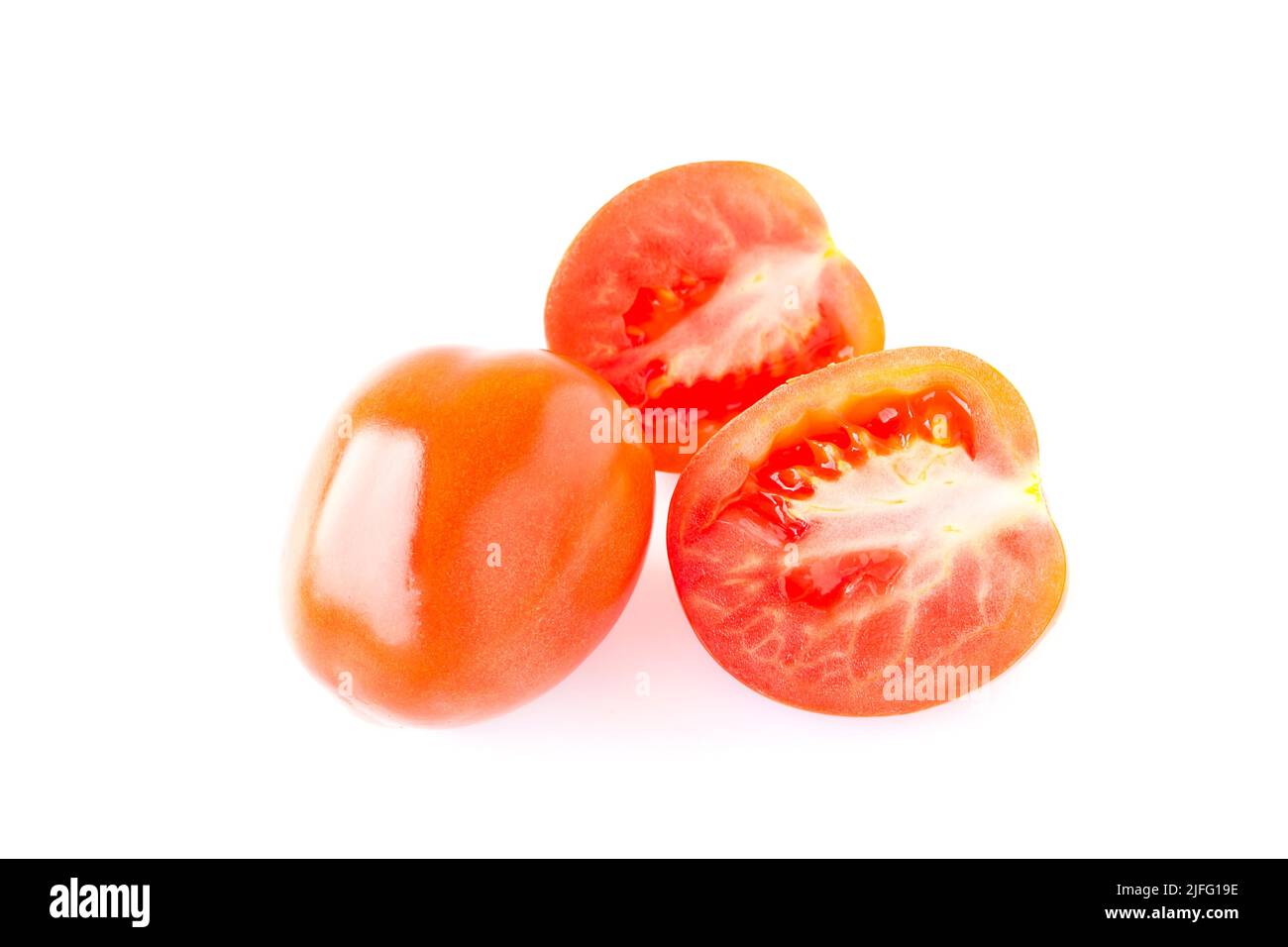 Red tomatos isolated on a white background Stock Photo - Alamy