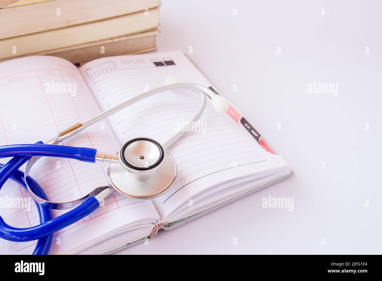 Stethoscope and books on a white background Stock Photo - Alamy