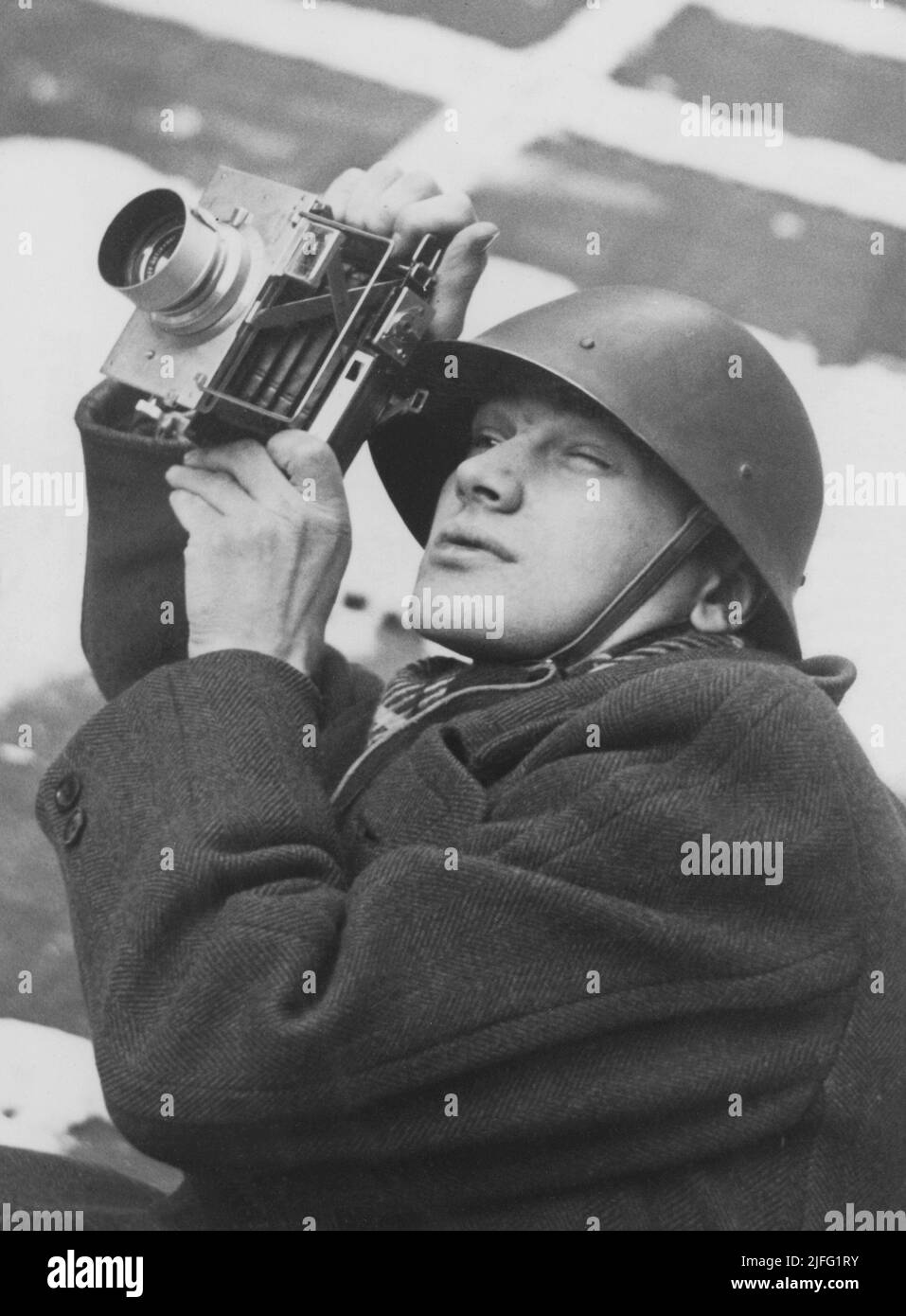 The Winter War. A military conflict between the Soviet union and Finland. It began with a Soviet invasion on november 1939 when Soviet infantery crossed the border on the Karelian Isthmus.  Pictured Karl Gustaf Kristoffersson. 1918-2011. Swedish photographer. A press photographer who in connection with the outbreak of World War II in 1939 contributed to the breakthrough of photojournalism that took place at that time. One of his first assignments was to document the Winter War in Finland 1939-1930. He was the youngest war-photographer in Finland, just 21 years old.  Here with camera. Stock Photo