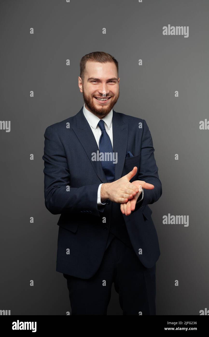 Happy attractive young businessman wearing suit portrait Stock Photo ...