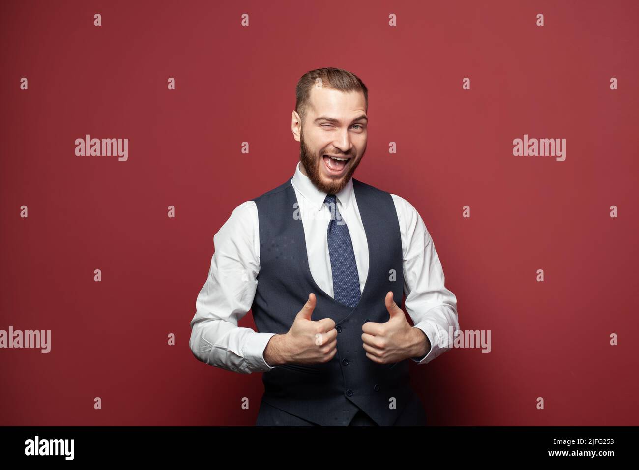Excited successful businessman winking hi-res stock photography and ...