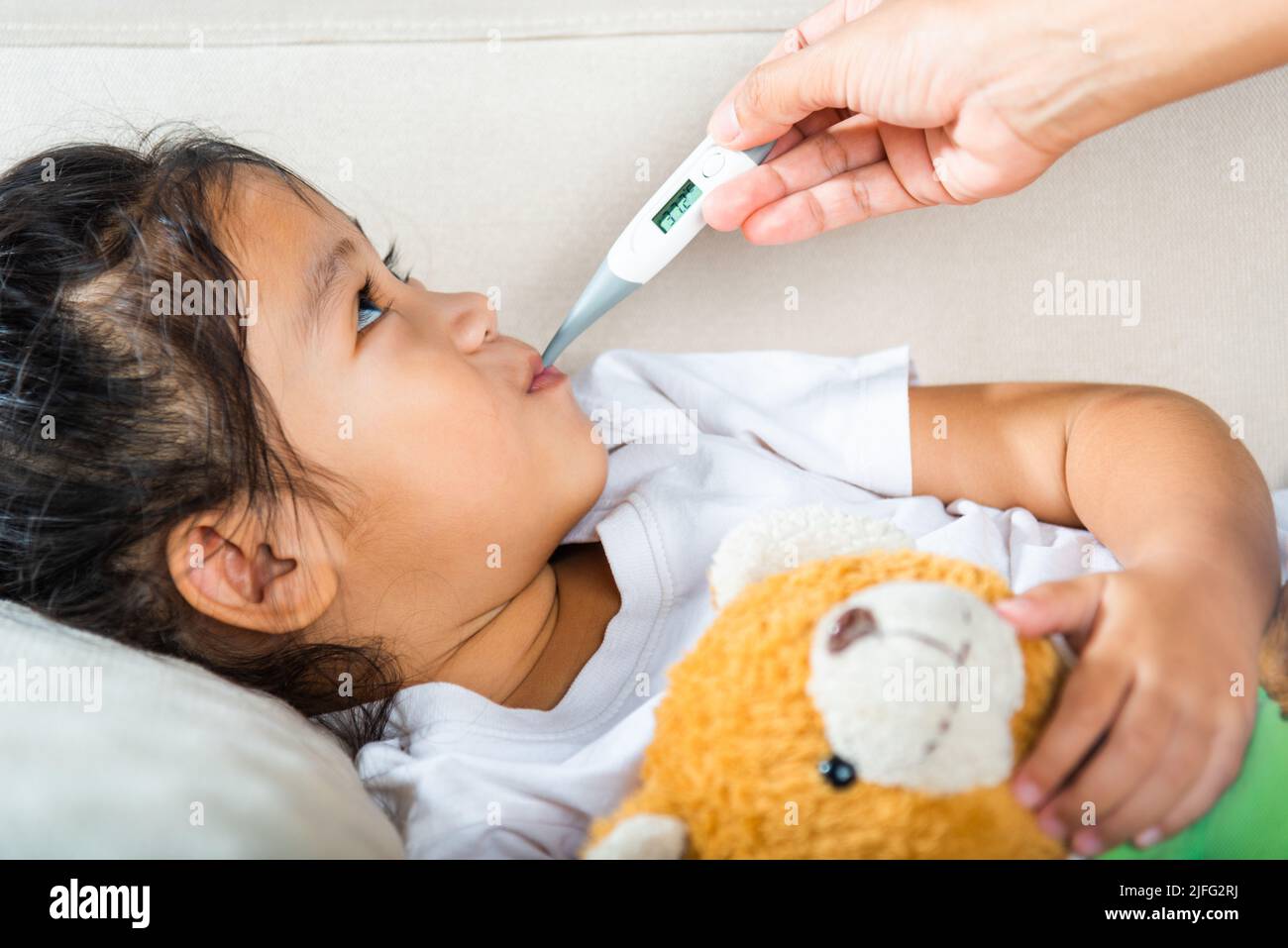 Child 2024 with thermometer