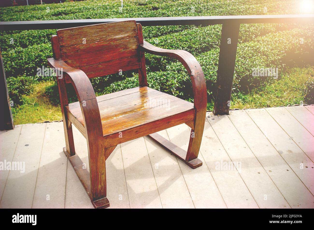 Outdoor with vintage wooden chair on the floor Vintage filter Stock