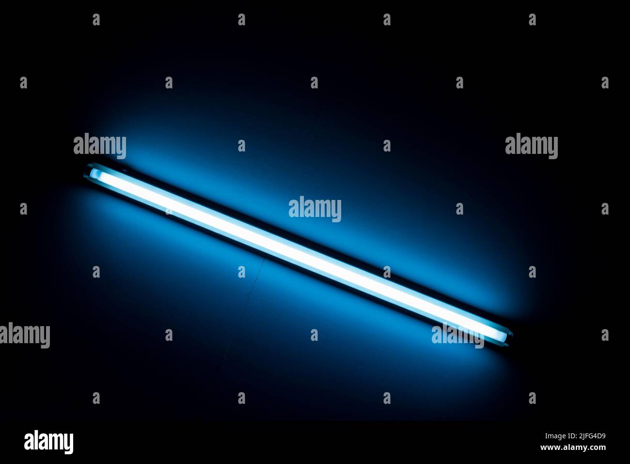 Detail of a fluorescent light tube mounted on a wall Stock Photo Alamy