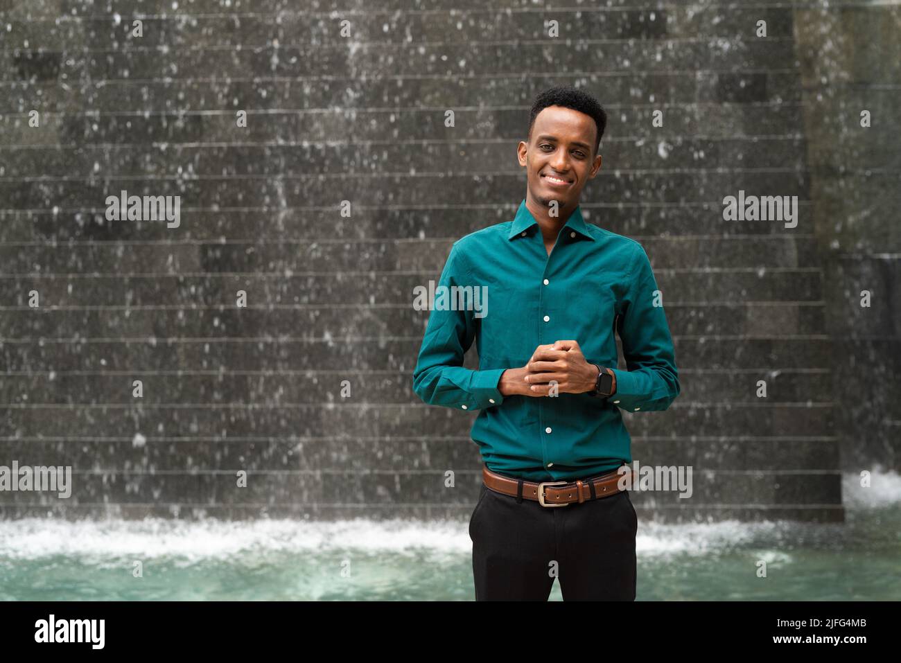 Portrait of handsome young black man outdoors during summer Stock Photo