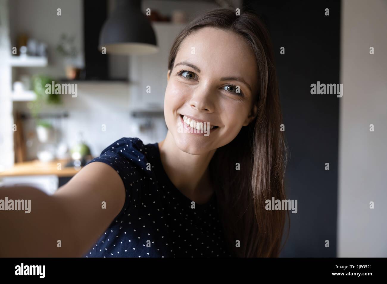 Selfie picture of happy beautiful young woman looking at camera Stock Photo
