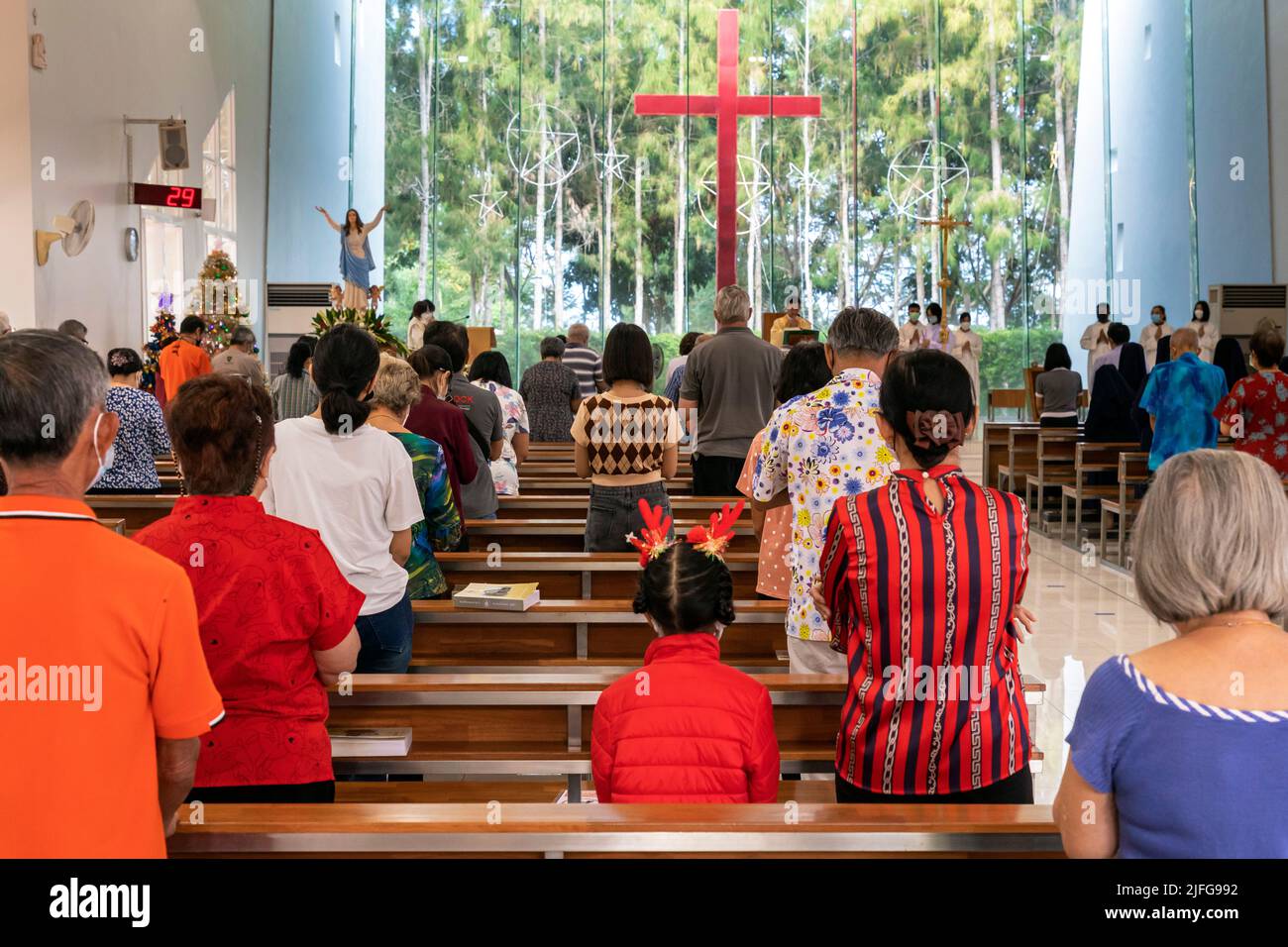 Christmas mass and congregation at Assumption Church, Banglamung Siam Country Club, Pattaya, Chonburi, Thailand Stock Photo