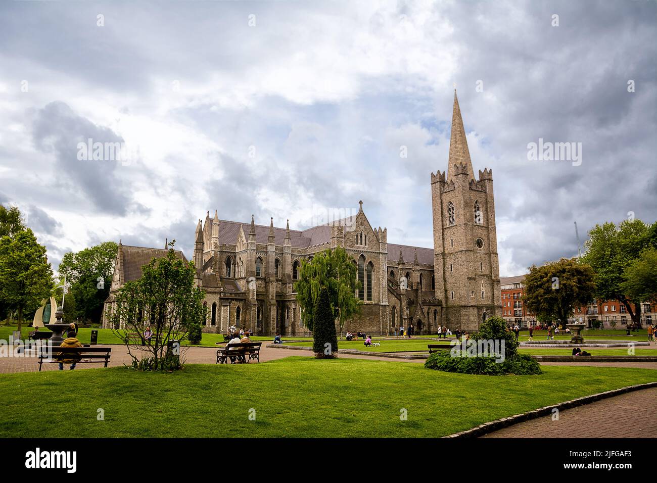 Dublin, Ireland - May 22, 2022: St. Patrick's Cathedral, with the tower and gardens in the centre of Dublin, Ireland. Stock Photo