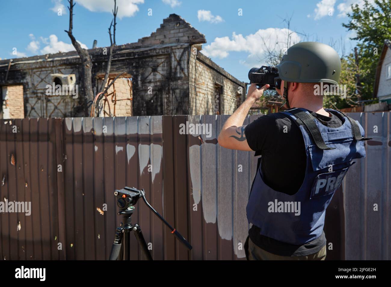 War correspondent photographs destroyed buildings after the bombing in