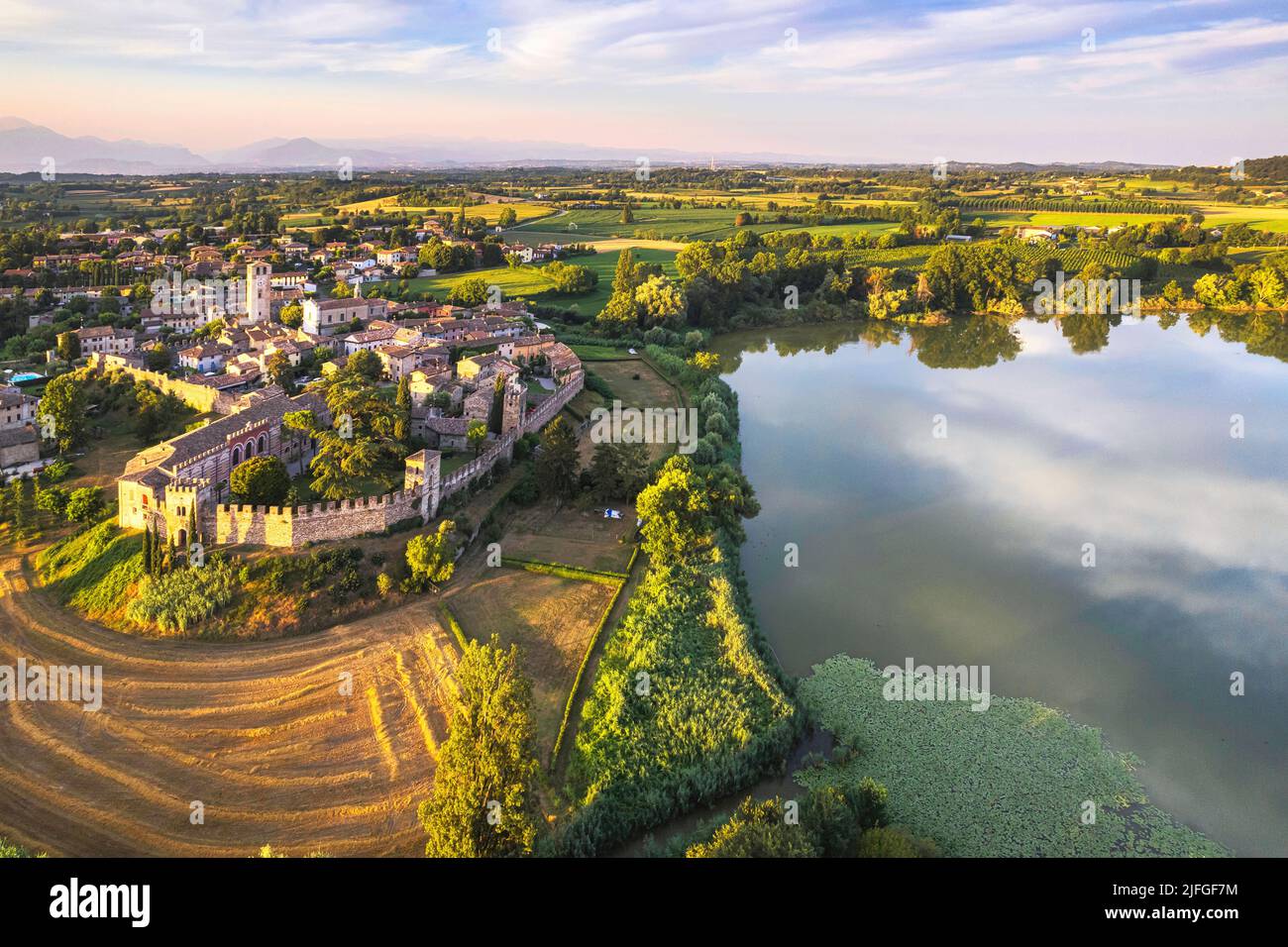 Aerial view of one of the best village of Italy with heart-shaped lake, Castellaro Lagusello, Mantova, Italy Stock Photo