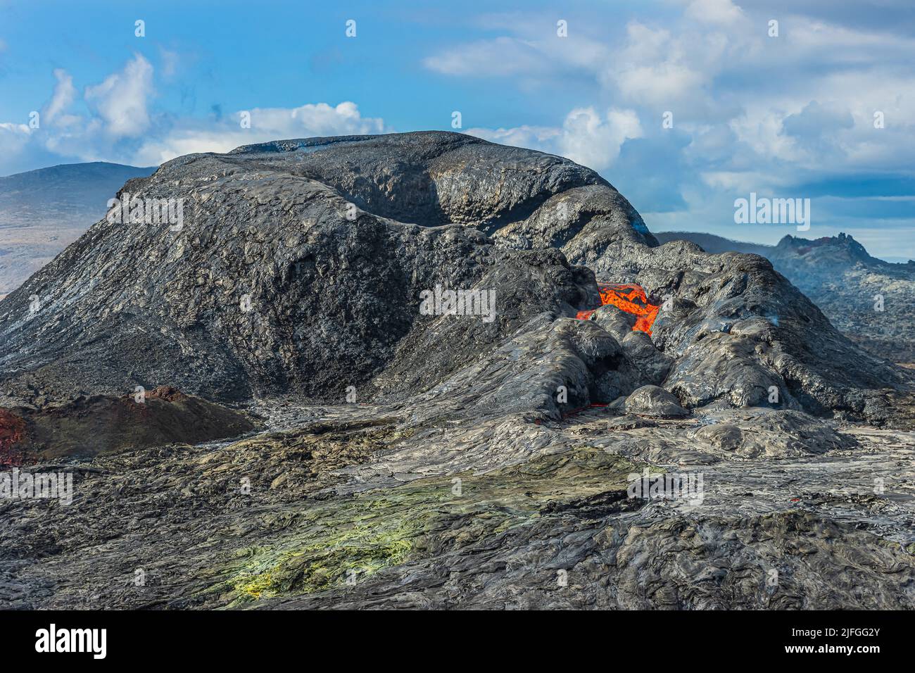 active volcanic crater in Iceland during the day with sunshine. Volcanic landscape on Reykjanes Peninsula. just before the volcanic eruption. little m Stock Photo