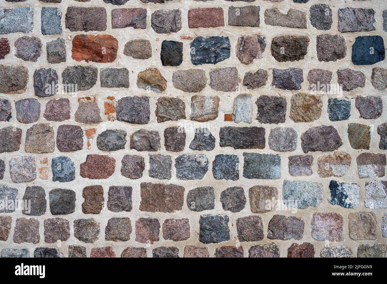 Background from a natural stone wall of an old building Stock Photo