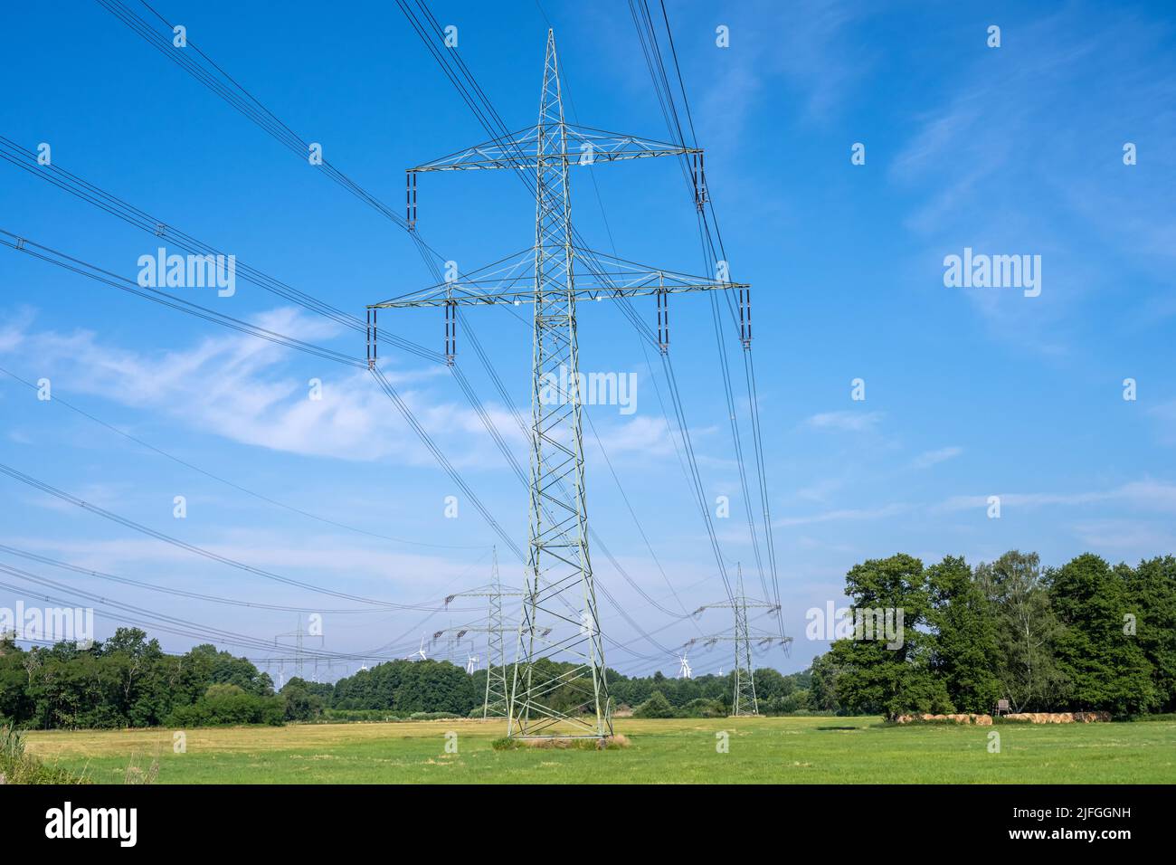 Electric power lines with a steel pylon seen in Germany Stock Photo