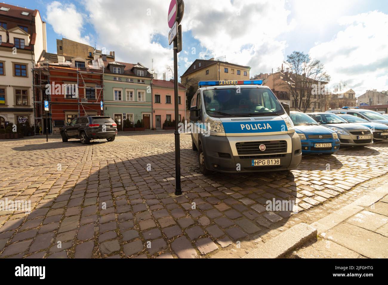 10-03-2022. krakow-poland. Police cars parked on Szeroka Street, Kazimierz Krakow neighborhood, cloudy skies Stock Photo