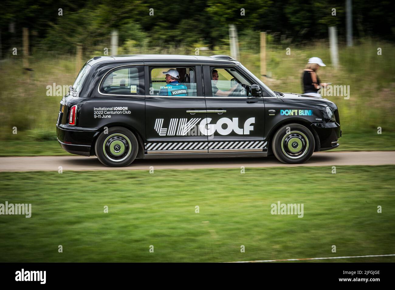 One of a fleet of 18 electric TX Taxi London Black Cabs were player transport out to the starting tees for the Shot Gun start at LIV Golf London Stock Photo