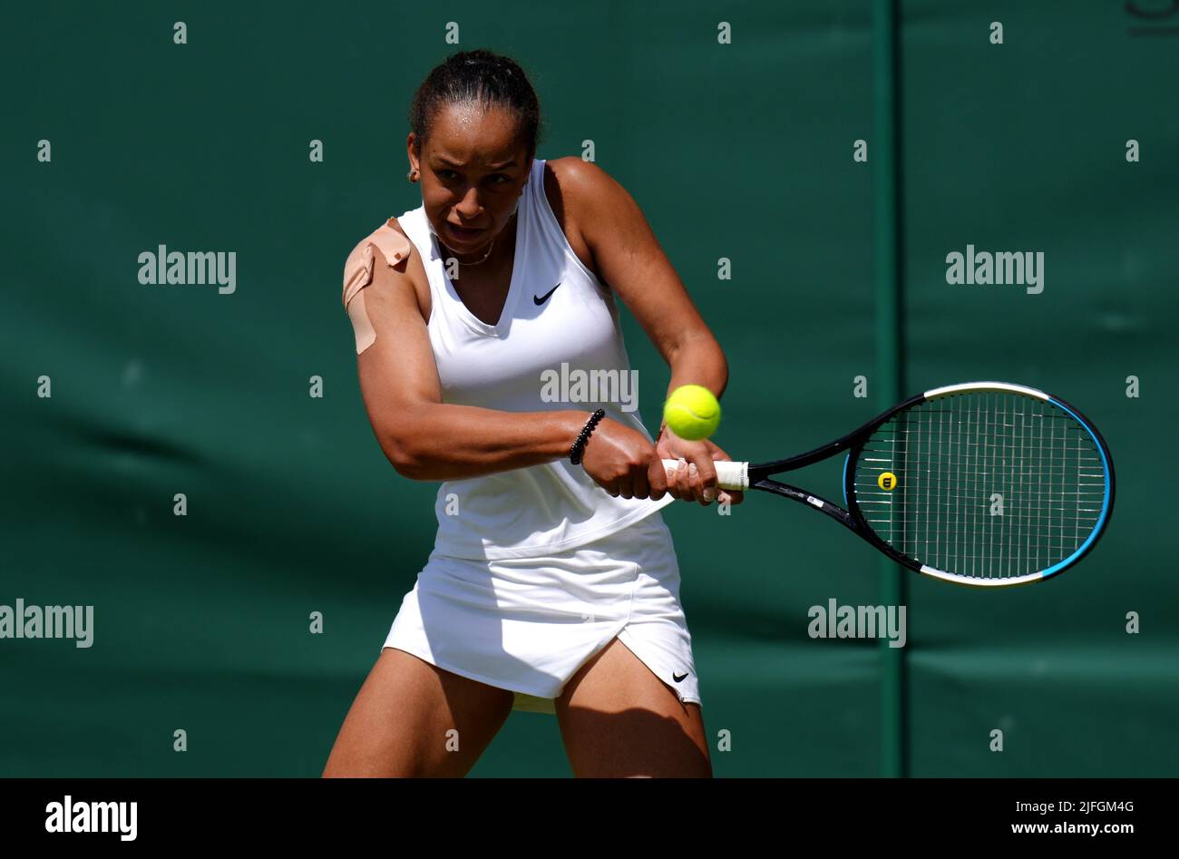 Sofia Johnson in action during her Girls Singles first round match against  Victoria Mboko during day seven of the 2022 Wimbledon Championships at the  All England Lawn Tennis and Croquet Club, Wimbledon.