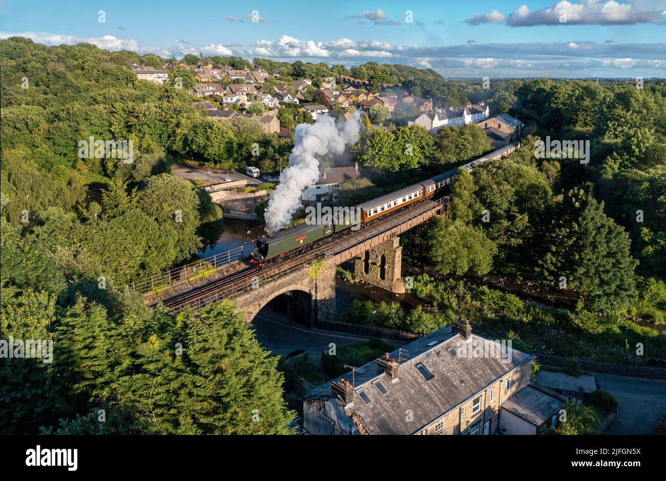 Summerseat, Greater Manchester, UK. 2nd July, 2022. 34092 'City of Wells' heads the East Lancashire Railways Summer Evening dining train crossing Brooksbottom Viaduct. Credit: Tom McAtee/Alamy Live News Stock Photo