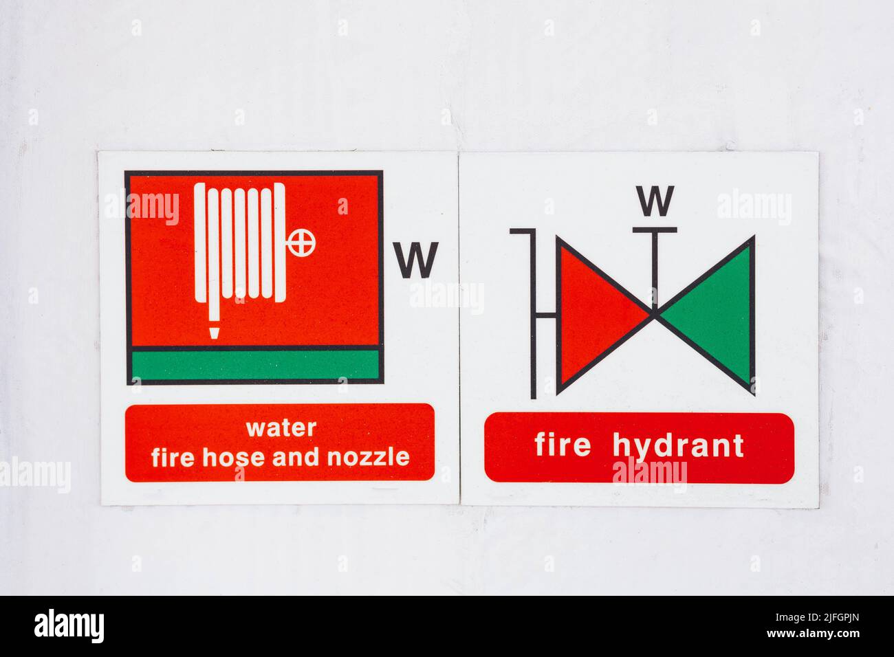 Water fire hose, nozzle and fire hydrant notice, sign Stock Photo Alamy