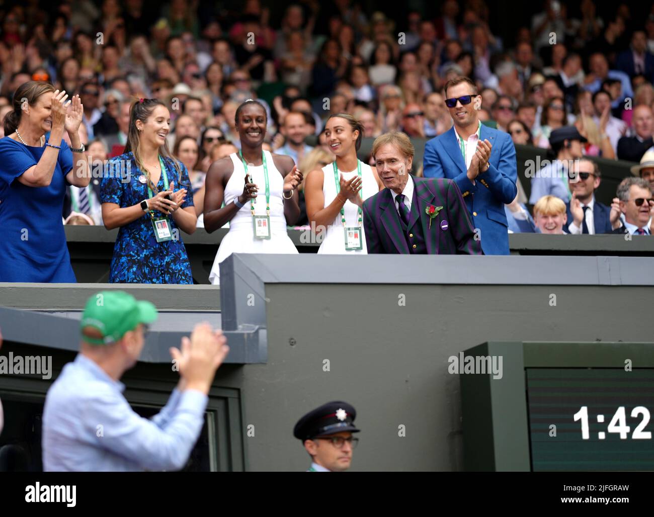 Sir Cliff Richard entertains the crowd on centre court during day seven