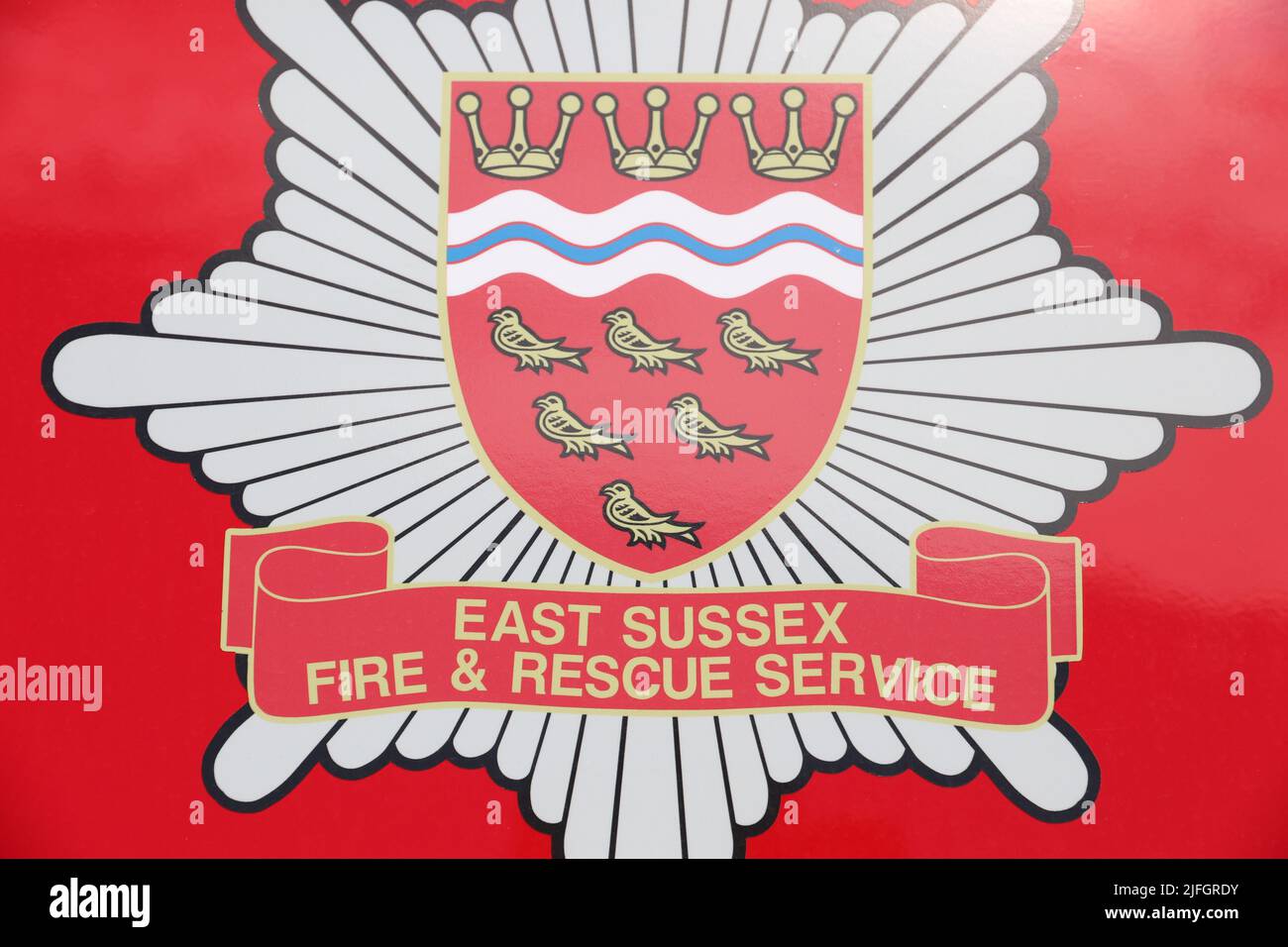 EAST SUSSEX FIRE & RESCUE SERVICE BADGE LOGO LETTERING Stock Photo