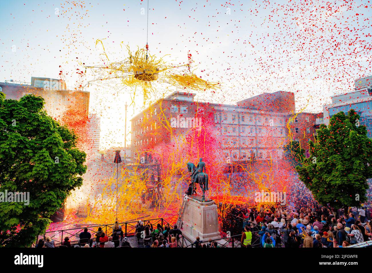 The finale to an outdoor performance in Coventry City Centre. The Awakening by Gratte Ciel included colourful confetti and streamers being fired. Stock Photo