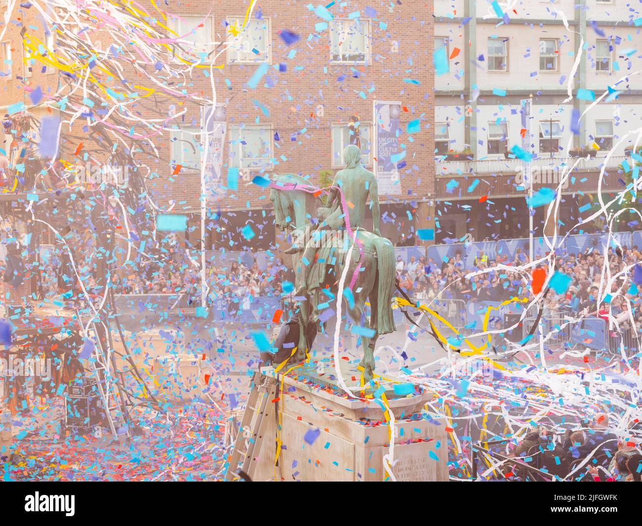 The finale to an outdoor performance in Coventry City Centre. The Awakening by Gratte Ciel included colourful confetti and streamers being fired. Stock Photo
